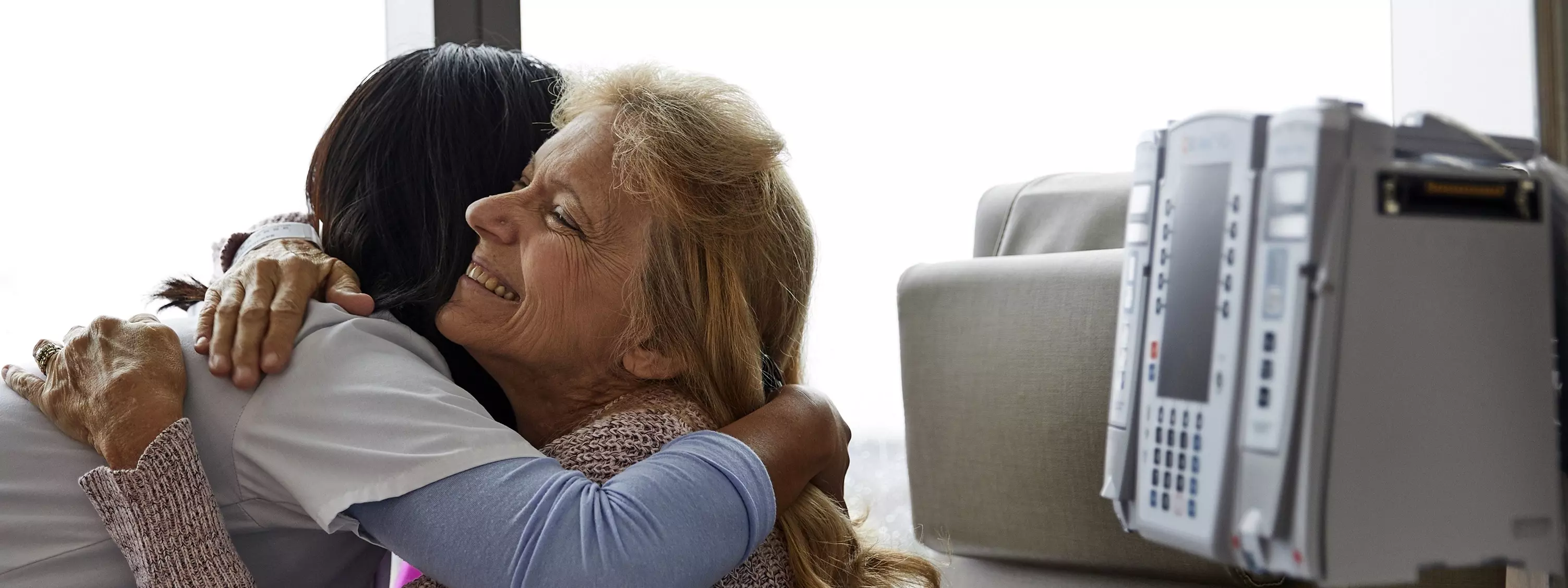 Nurse hugging to patient